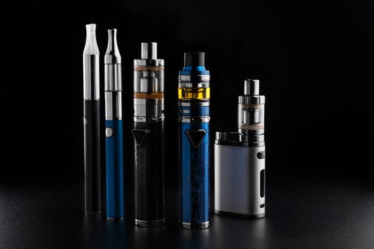 electronic cigarettes or vaping devices on black background