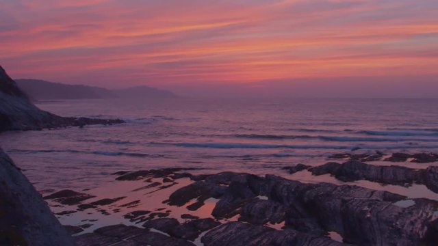 Pan shot of the sea at dawn