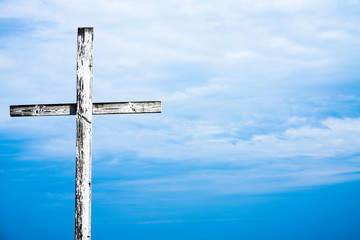 white cross against the sky