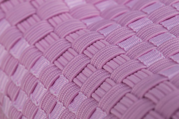 Fragment of pink sneaker fabric. The texture of the material of sports shoes