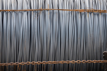 steel wire coil with rusty metal chain as fastener. metal work background.  concept : transport raw...