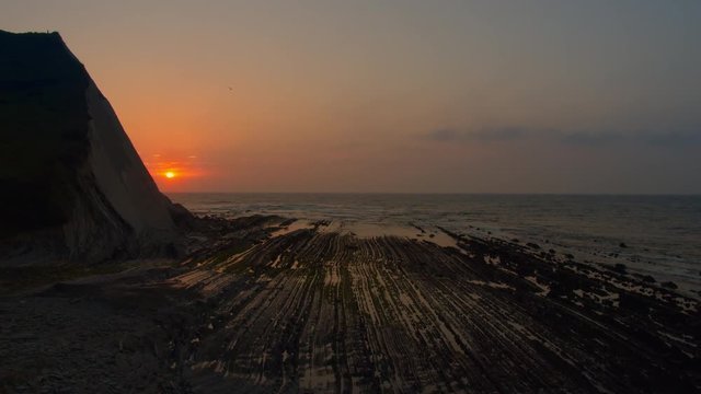 Zoom out sunset at Flysch