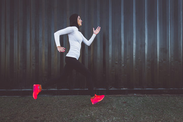 Arabic woman runner, making some urban running