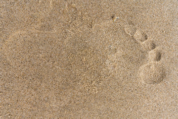 Fototapeta na wymiar Barfuß Fußabdruck im Sand