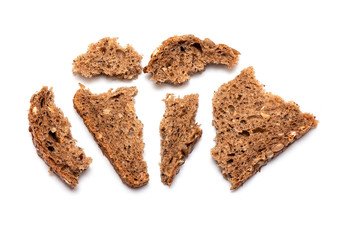 Top view of crumbled multi Grain brown Bread isolated on white Background