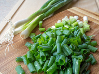 Green Onion on wood background