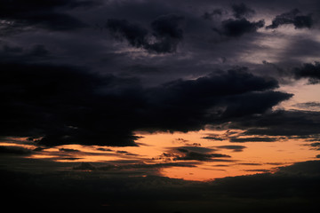 Beautiful sunset - dark sky with clouds and sunlight