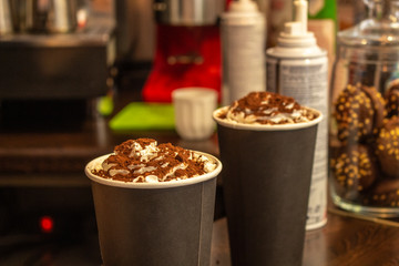 Coffee with foam. Drink dessert. Tasty food. A treat at a coffee shop. Chocolate cocktail. Products in a coffee shop