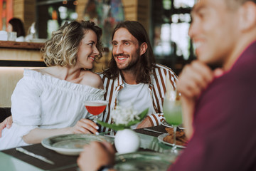 Beautiful couple spending time together in cafe