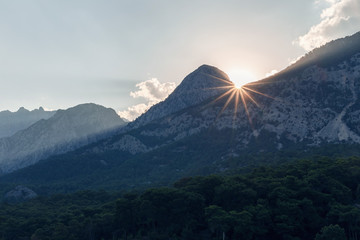 Beautiful landscape in the mountains at sunset. Lovely view of the Taurus Mountains at sunset. Soft sunlight falls on the mountain tops. Kemer, Turkey. Postcard view