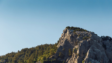 Beautiful landscape in the mountain view. Beautiful view of the Taurus mountains in the morning sun against the blue sky. Kemer, Turkey.