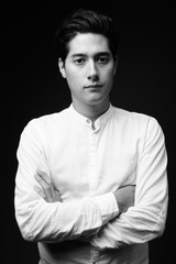 Fototapeta na wymiar Young multi-ethnic handsome man in black and white