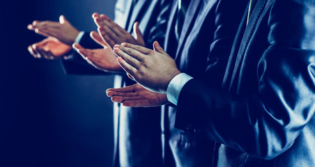 success concept: business team applauding business partners afte