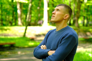 Portrait of young man in casual fashion clothes. Outdoor street photo