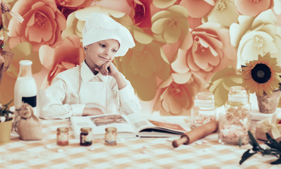 cute little baby is preparing tasty meals the kitchen