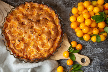 yellow plum mirabelle. Plum pie on a dark background. Summer fruit season.harvest.