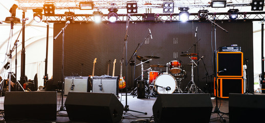 An empty Stage Before the Concert with floodlight, musical instruments