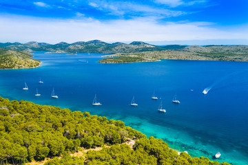 Aerial view of the blue bay and small islands in nature park Telascica, Croatia, Dugi otok, yachts anchored on shore