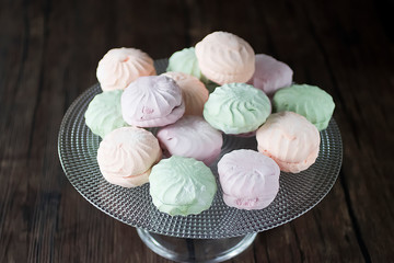 Handmade fruit marshmallow on a transparent glass plate.