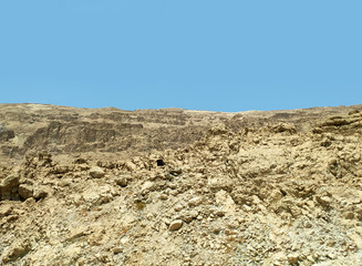 Desert landscape with rocks, hills and mountains