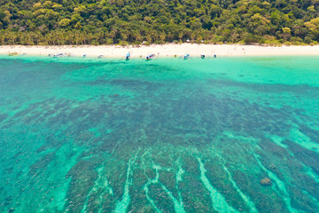 Puka Shell Beach, Boracay Island, Philippines, aerial view. Colorful lagoon with clear water and...