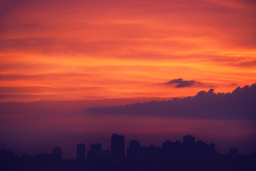 Dramatic sunset over the evening city.