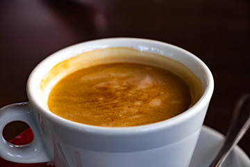 cup of coffee on wooden table