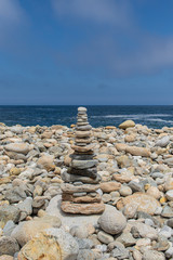 Towers of balanced dolomite stones on the beach