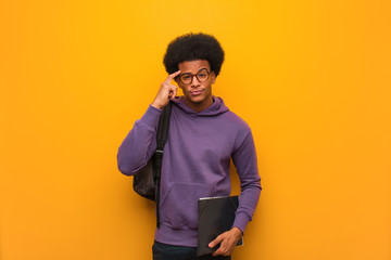 Young african american student man thinking about an idea