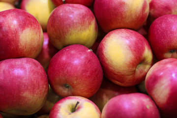 Lots of fresh delicious red apples as background