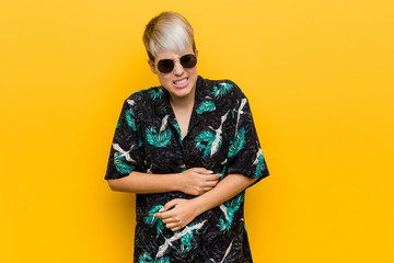 Young curvy woman wearing a summer look sick, suffering from stomachache, painful disease concept.