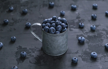 Fresh blueberry berries on a dark background. Vegan 