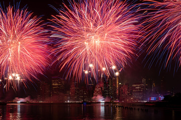 Macy's 4th of July Independence Day Fireworks show on east river with Lower Manhattan Skyline