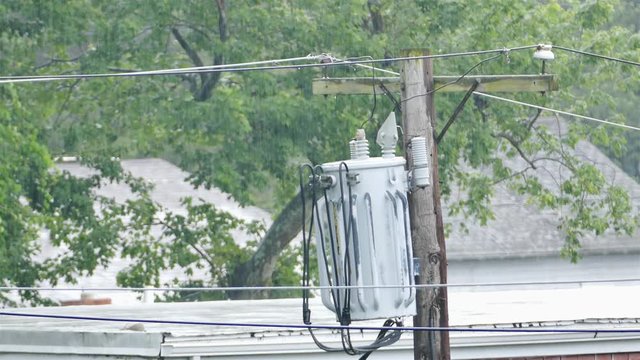 An electric transformer in rainy summer day