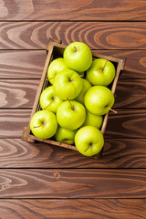 Fresh apples in wooden crate. Close up