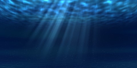 Sun and sunbeams underwater shining through ocean surface. Sea deep underwater