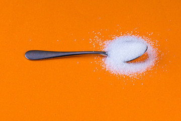 Spoon with fine white sugar