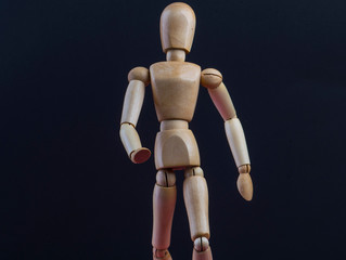 wooden mannequin in action and movement