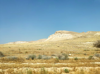 Desert landscape with rocks, hills and mountains
