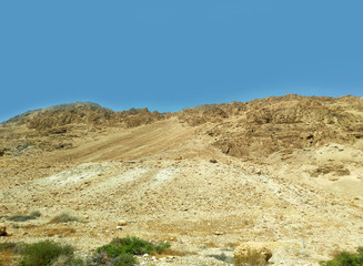 Desert landscape with rocks, hills and mountains