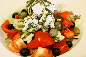 Fresh summer salad with tomatoes, cucumber, pepper, feta cheese and olives
