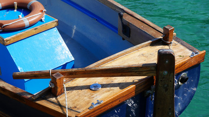 Sections of a Cornish wooden ferry boat in sunshine