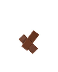 Milk organic chocolate pieces isolated over white background.