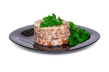 Jellied meat decorated with parsley on a black plate