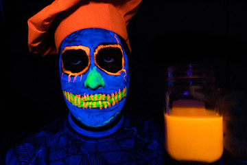 Man with neon makeup for a Neon Party For halloween