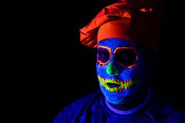 Man with neon makeup for a Neon Party For halloween