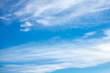 Cirrostratus clouds on blue sunny sky.