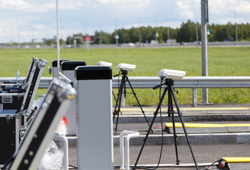 checkpoint police on the road. cameras on tripods and equipment in cases for inspection of entering...