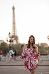 Beautiful girl is walking in Paris with Eiffel tower view , France