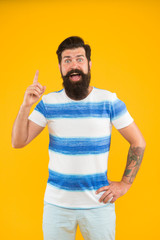 Summer vacation. Man bearded hipster with mustache and long beard on yellow background. Guy dressed...